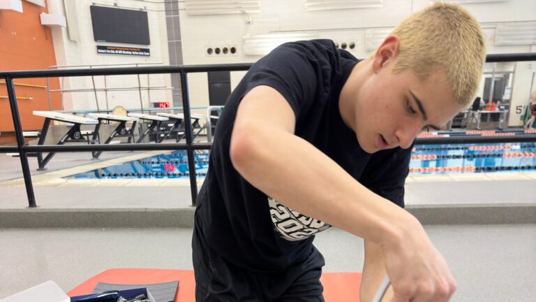 How and why high school swimmers embrace high tech at their biggest competitions
