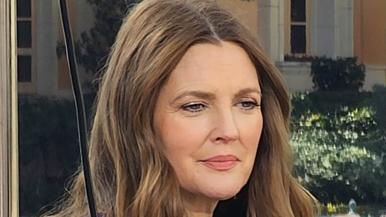 Drew Barrymore rocks Super Bowl LVIII jacket as she gives animated interview on the Las Vegas Strip ahead of the big game