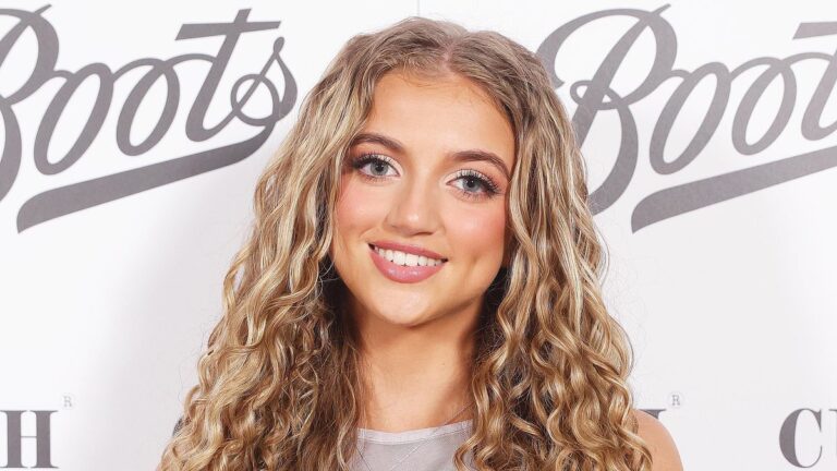 Princess Andre, 16, continues her new career as an influencer by wearing a glamorous silver metallic dress to a beauty launch party.