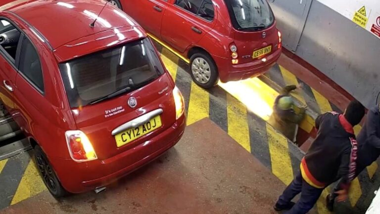 The moment a woman disappears into the inspection pit at a London garage
