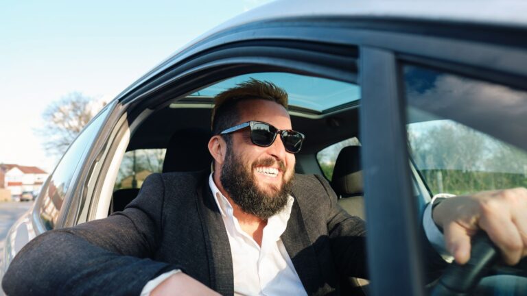 “Great idea,” the driver exclaims as he picks up a “good value” car accessory that won’t wrinkle his jacket.